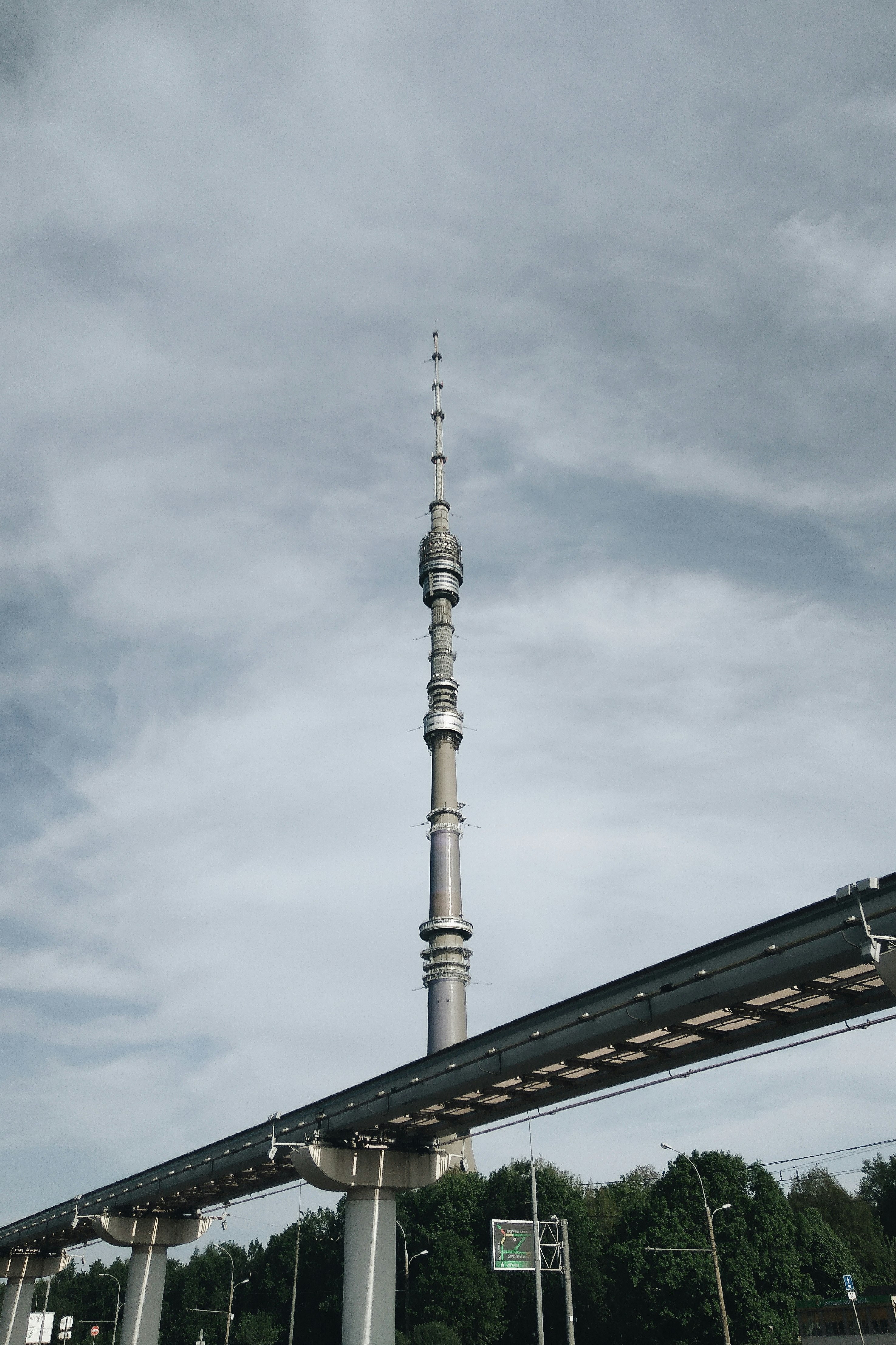 brown concrete tower under white clouds